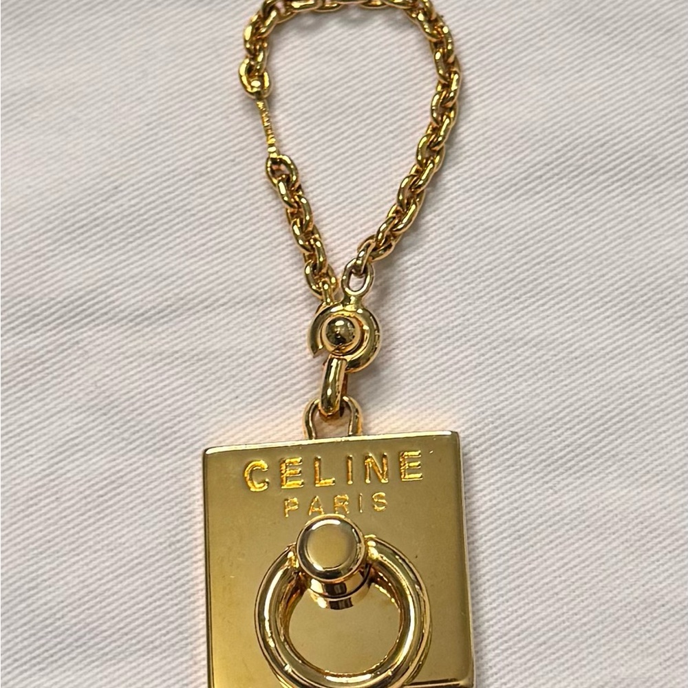 Celine Gold tone bag charm keychain